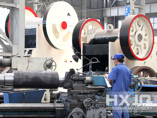 engineer inspecting small jaw crusher 